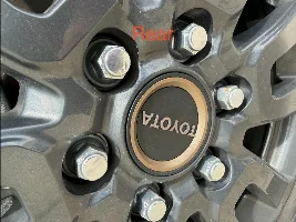 "TOYOTA" center cap will not completely seat in front wheel of '25 LC 1958