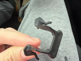 Found a small plastic clip in piece on my floorboard.  Help me identify it.